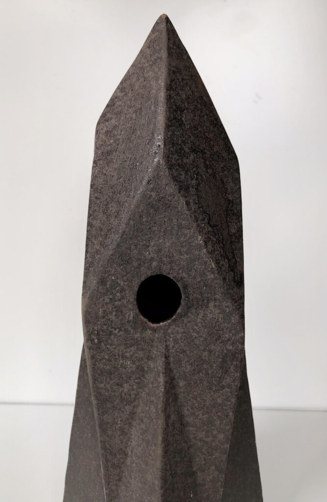view with hole HERLIV Brutalist ceramic monolith sculpture in the style of Jan van der Vaart, 30cm geometric stoneware totem with manganese oxide finish.