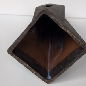 Bottom side HERLIV Brutalist ceramic monolith sculpture in the style of Jan van der Vaart, 30cm geometric stoneware totem with manganese oxide finish.